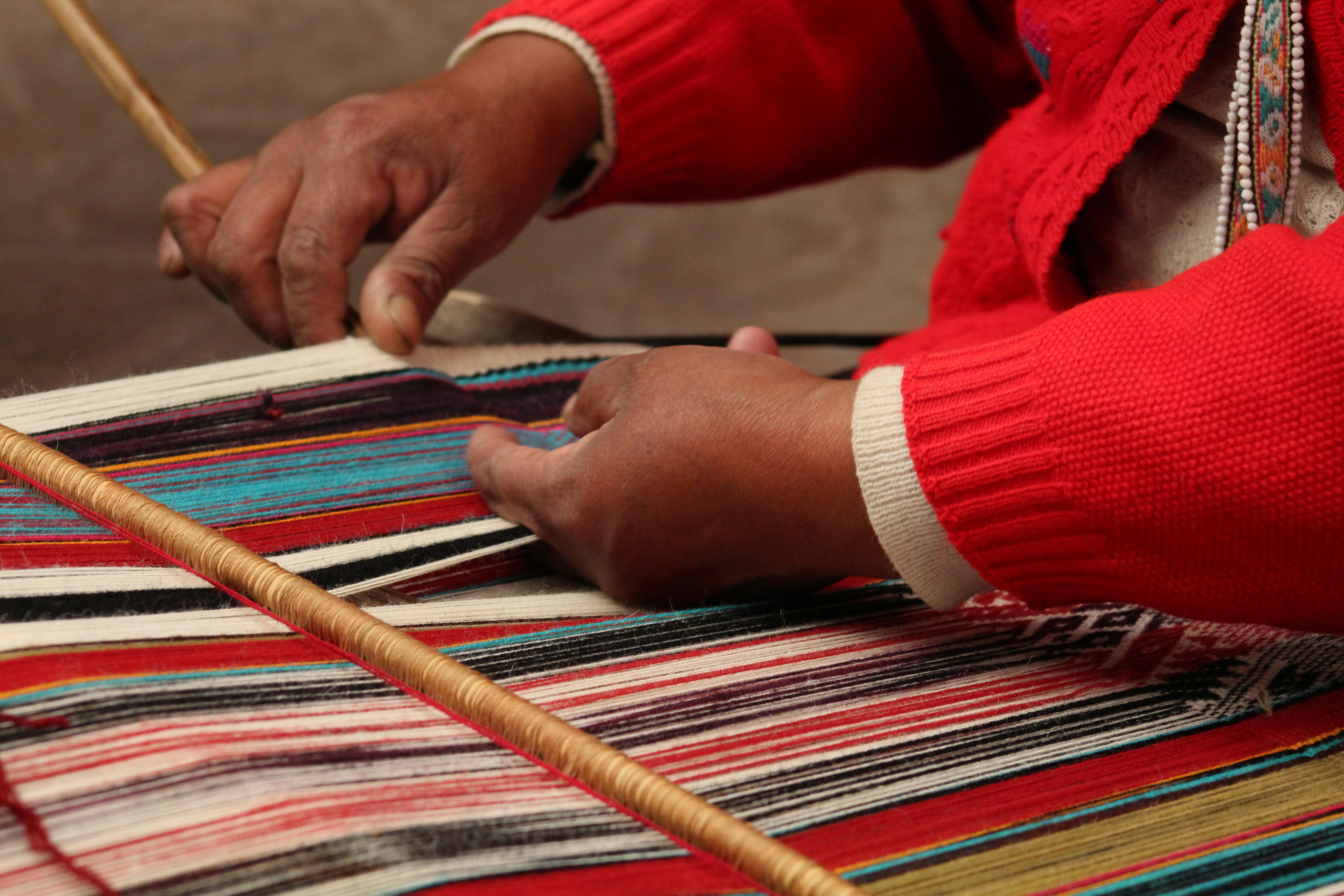 Traveler and local guide walking through the Peruvian Andes